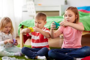 kids with modelling clay or slimes at home